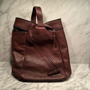 Versatile, rich, chocolate brown shoulder bag with adjustable strap.